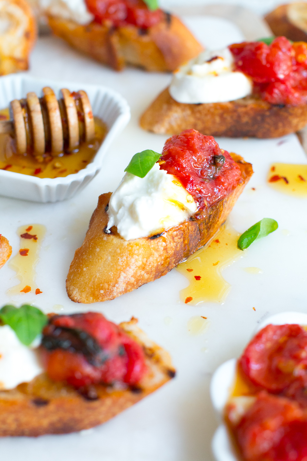 Tomato Confit & Burrata Crostini is the ultimate way to preserve those bright and sunny summer tomatoes