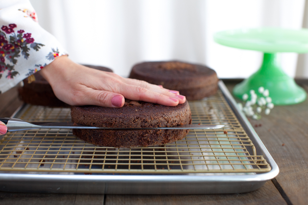 Once the cake layers have baked and cooled, slice each in half so you have 6 dramatic layers.