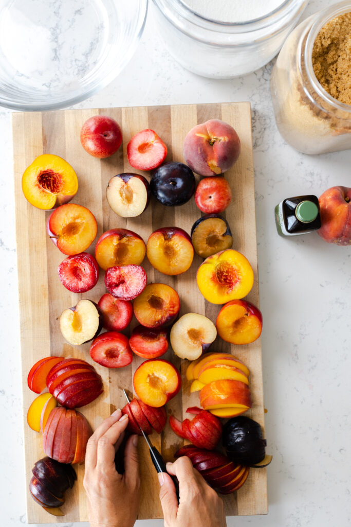 slicing summer stone fruit from New Seasons Market