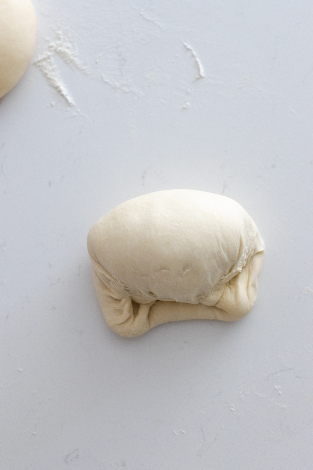 shaping pizza dough